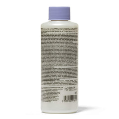 Ion Sensitive Scalp creme developer held in hand with refreshing fragrance and easy application