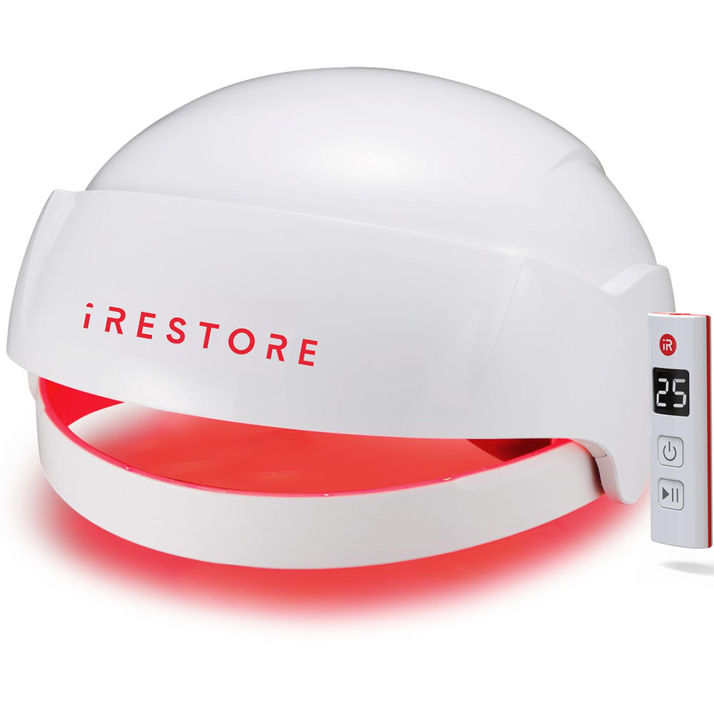 iRestore Essential device during use for at-home hair growth therapy.