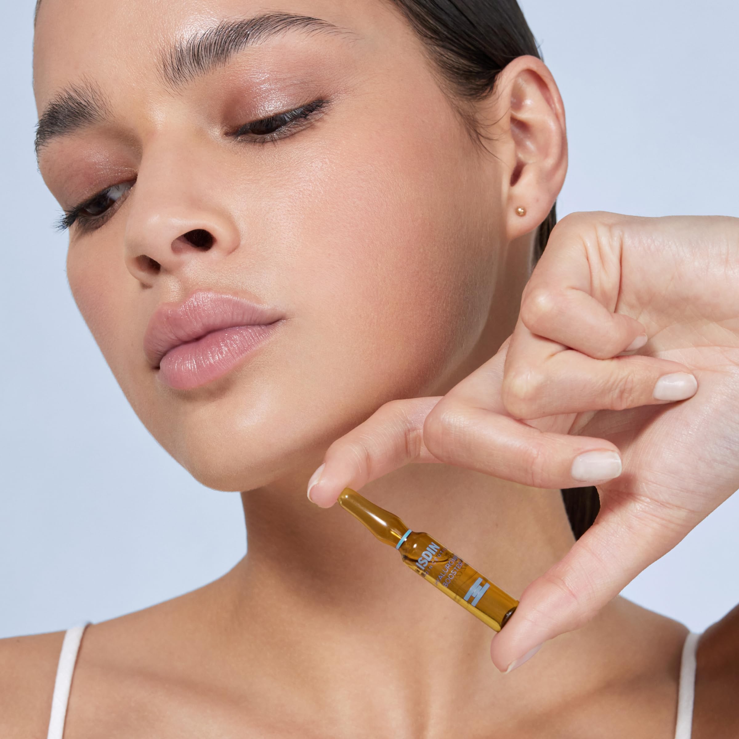 ISDIN Isdinceutics booster serum texture visible for fast absorption and non-greasy feel.
