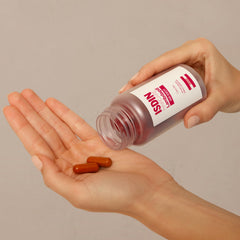 ISDIN Lambdapil capsules close-up showing vitamin-rich pills for hair roots.