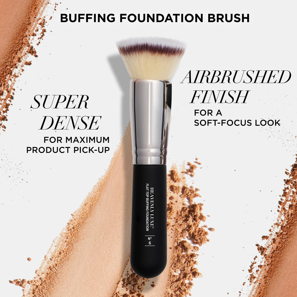 IT Cosmetics brush in hand shows ergonomic soft-touch handle for quick blending.