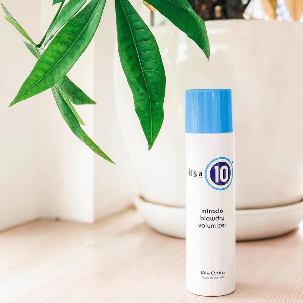 Its A 10 Miracle Blowdry Volumizer bottle back shows frizz-control ingredients