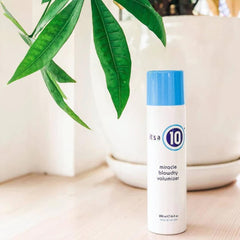 Its A 10 Miracle Blowdry Volumizer bottle back shows frizz-control ingredients