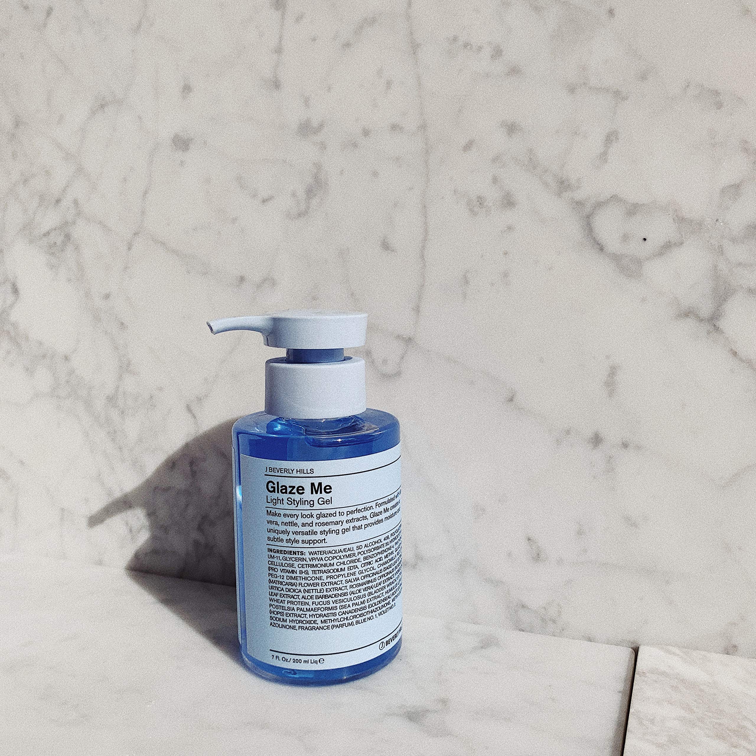Hands applying Blue Glaze Me to damp hair for light hold
