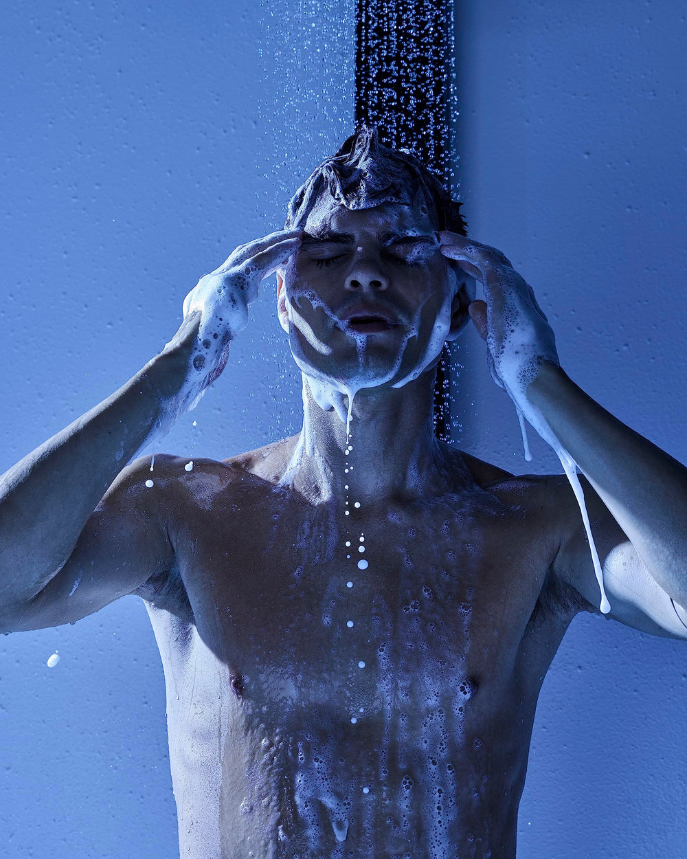 Jack Black Blue Midnight shower-scene highlights convenient, one-step wash for skin and hair.