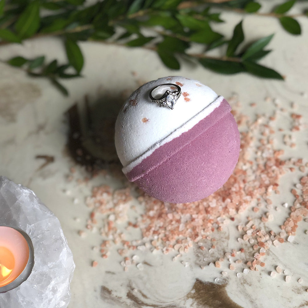 Jackpot Candles surprise jewelry bath bomb hints at jewelry inside for reveal.