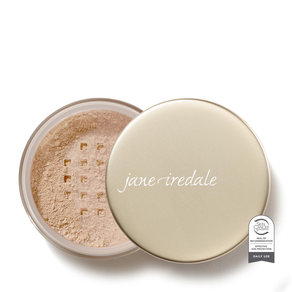 Jane Iredale Amazing Base loose powder being dispensed for sheer coverage and luminous finish.