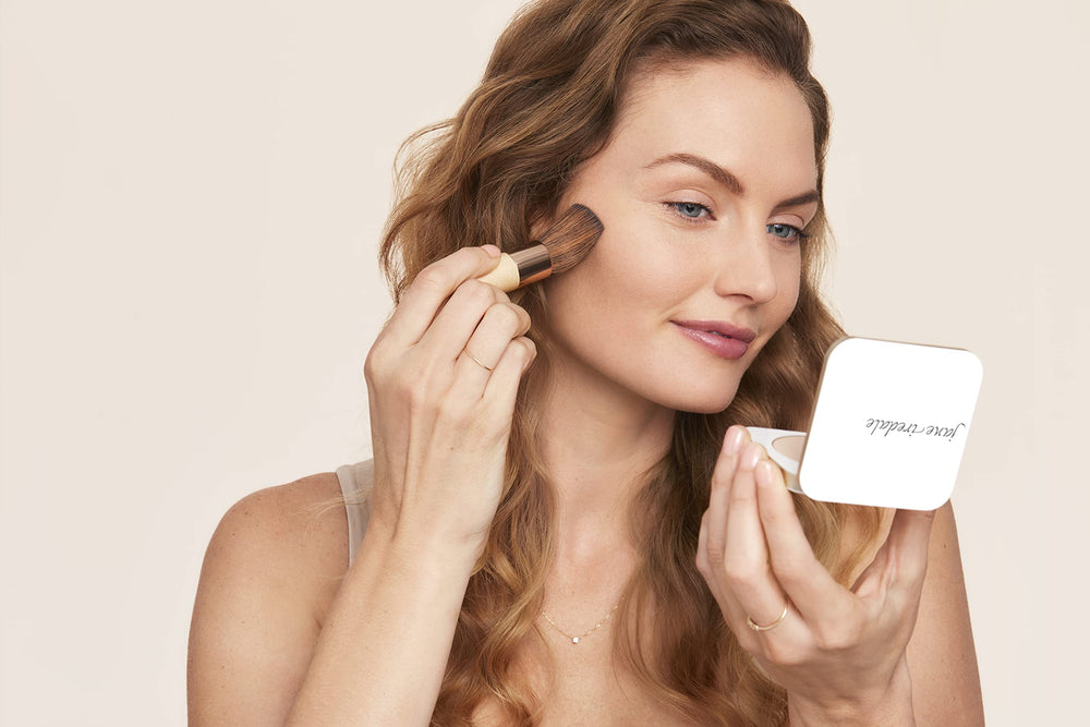 Jane Iredale PurePressed Base close-up texture shows oil-free, weightless formula.