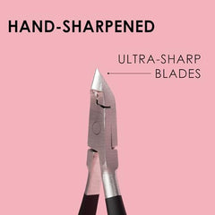 JAPONESQUE Cuticle Nipper Soft Touch closeup blade emphasizes sharp edge for clean hangnail removal.