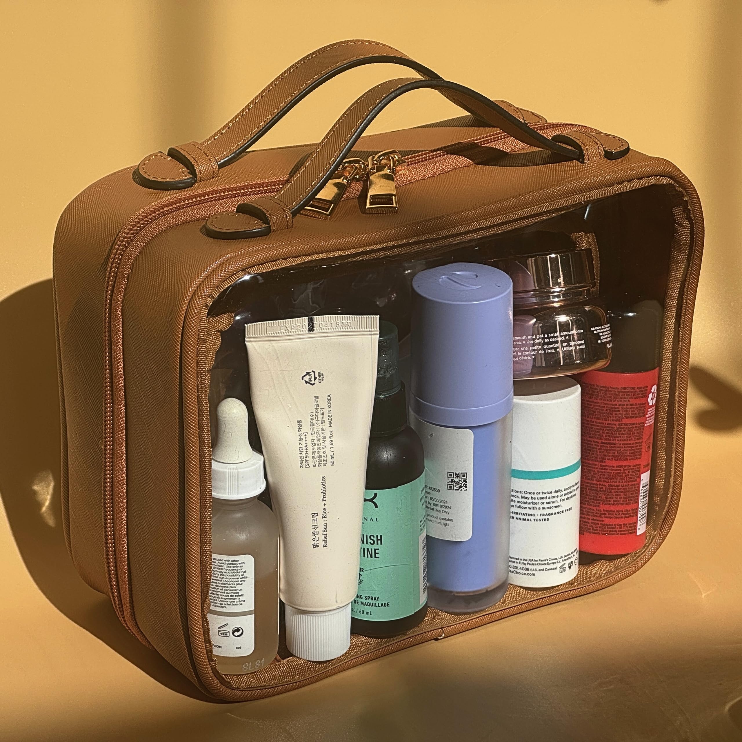 JAZD Clear Makeup Bag showcasing saffiano leather accents for durable, stylish travel