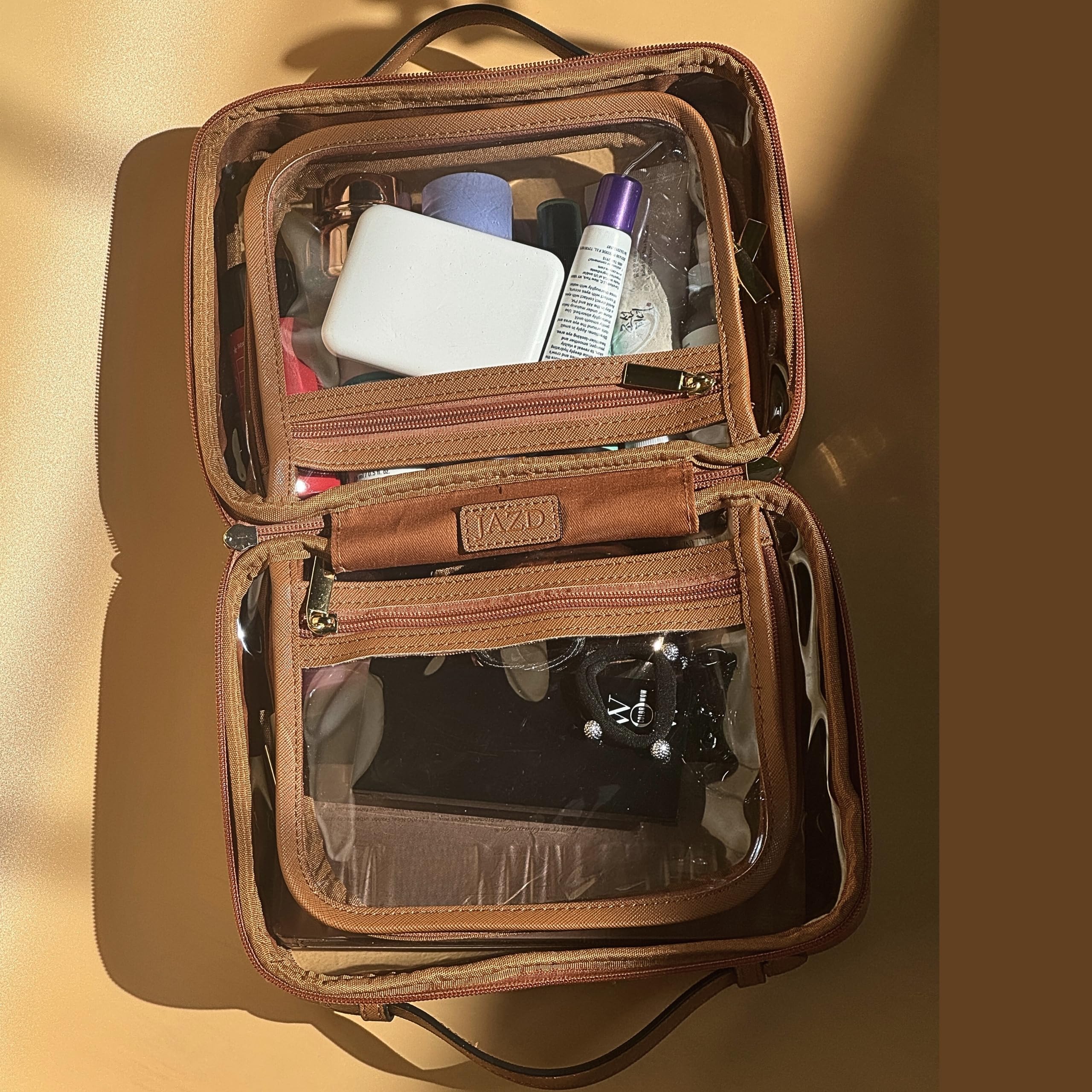 JAZD Clear Makeup Bag featuring two compartments for organized cosmetics and toiletries