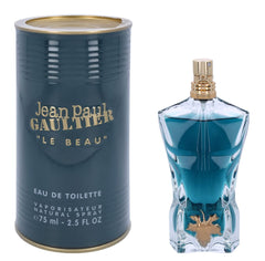 Jean Paul Gaultier Le Beau bottle with vine leaf conveys masculine elegance.