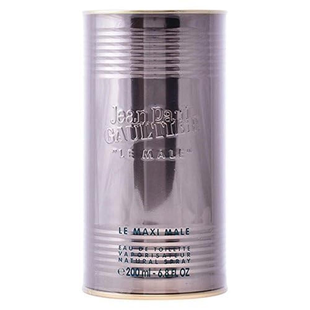 Jean Paul Gaultier Le Male ad captures iconic bottle in warm lighting.