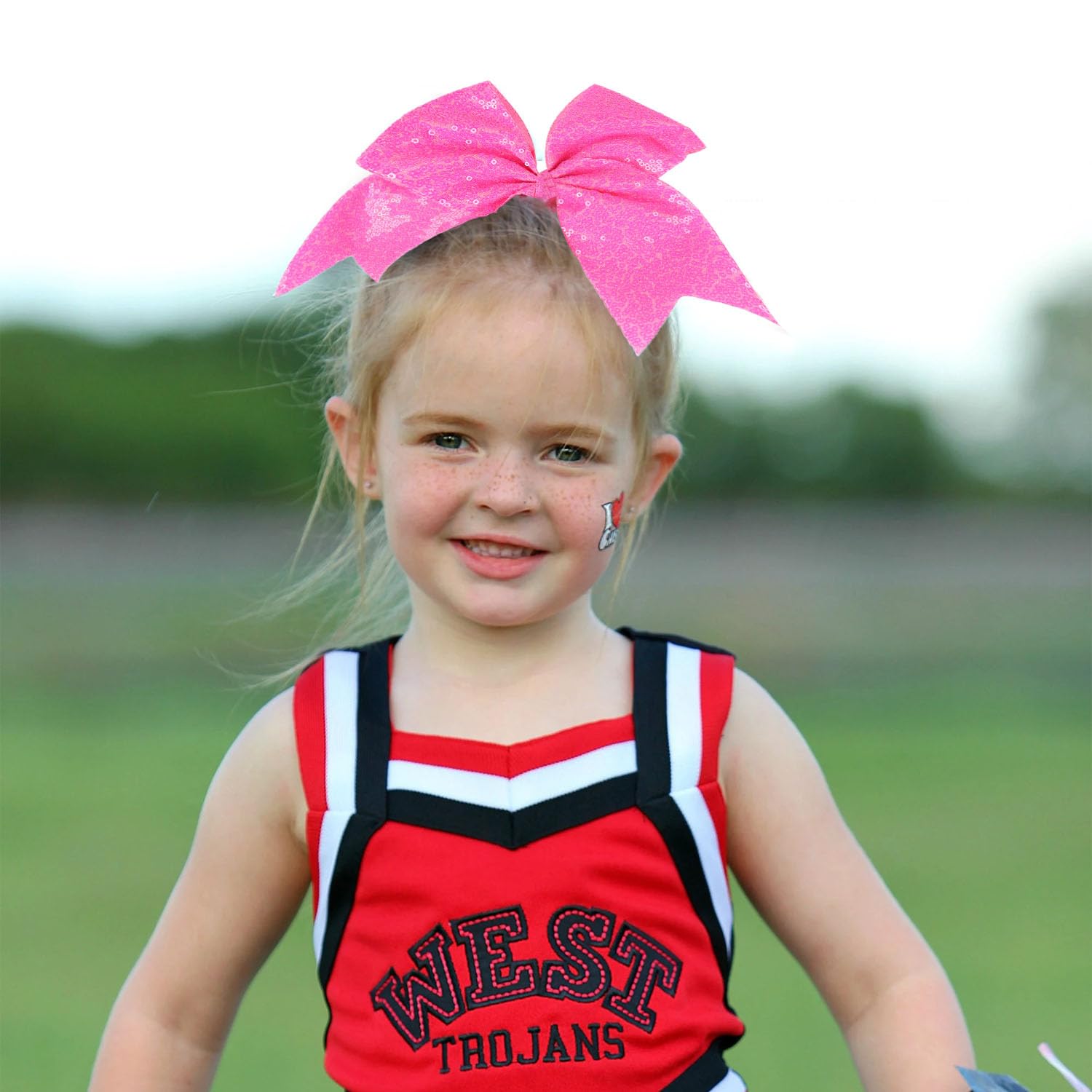 Jeffan sequin bow on-field performance captures glitter under stadium lights