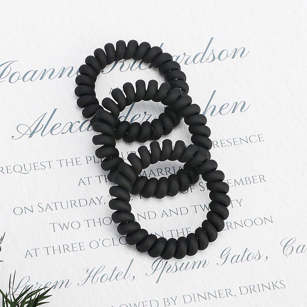 JessLab spiral hair ties worn as bracelet demonstrating fashion-friendly, ready-to-use accessory