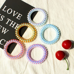 JessLab hair ties worn as bracelets, ready for on-the-go styling.