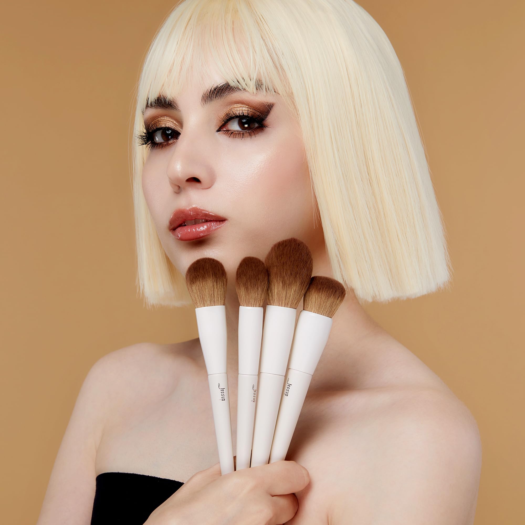 Jessup highlighter brush delivers luminous glow on cheeks.
