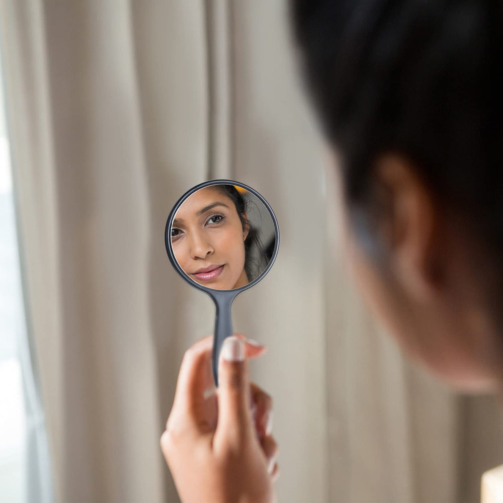 Jetec small compact handheld mirror for on-the-go touchups.