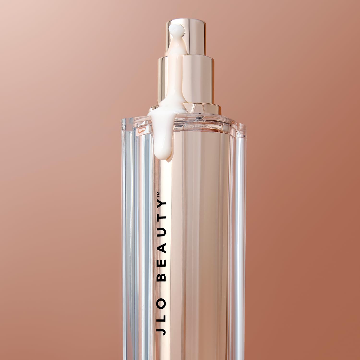 JLO BEAUTY Brightening Serum elegant jar closeup signals premium skincare ritual