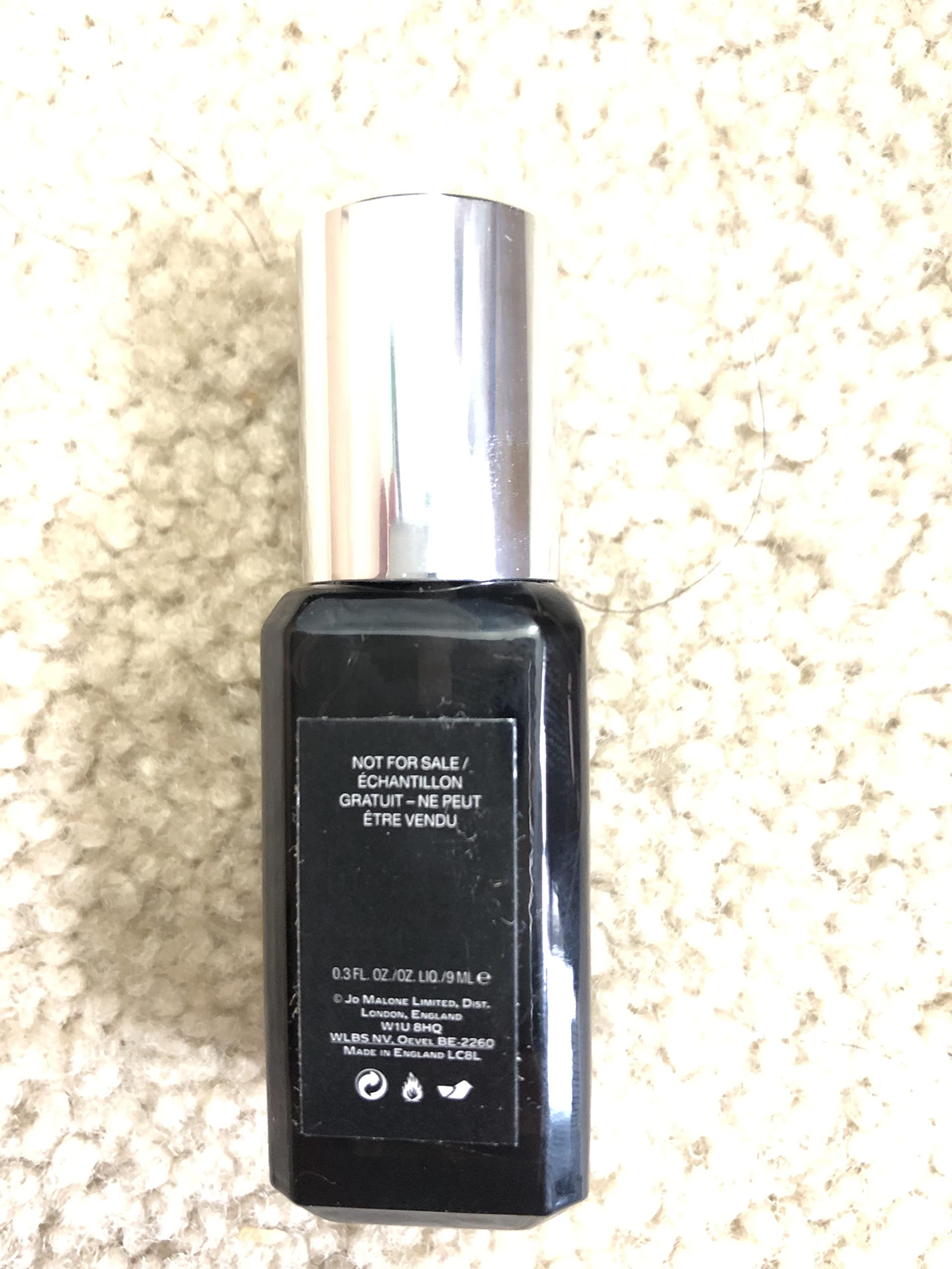 Lifestyle scene with Jo Malone Cypress & Grapevine—refined fragrance moment.
