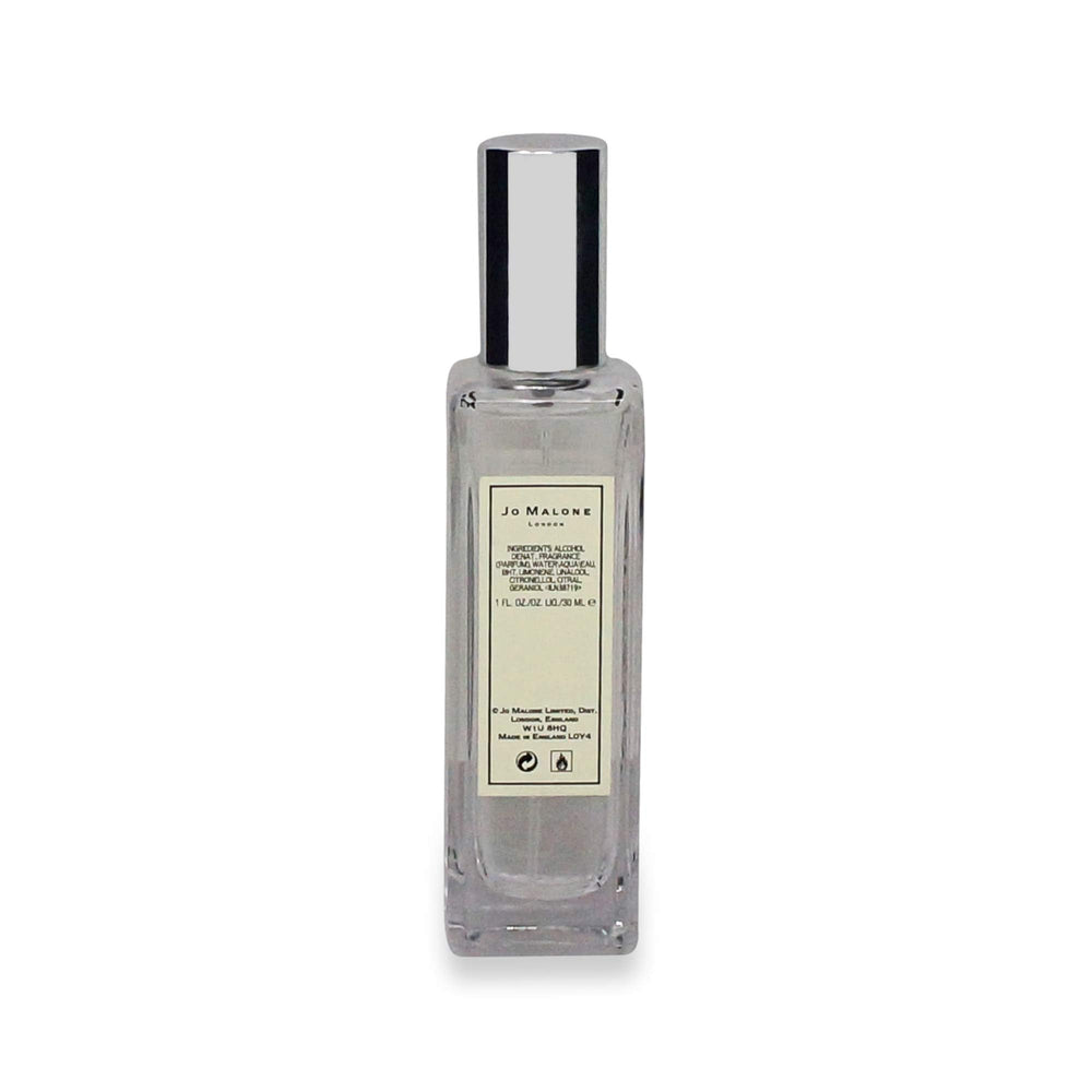 Gift-ready Jo Malone Nectarine Blossom & Honey packaging with soft lighting.