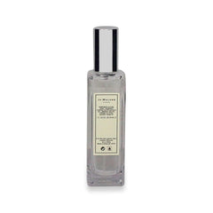 Gift-ready Jo Malone Nectarine Blossom & Honey packaging with soft lighting.