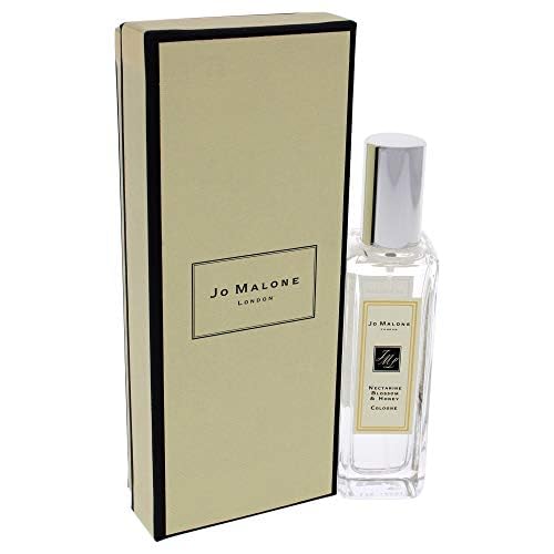 Elegant side view of Jo Malone Nectarine Blossom & Honey bottle for refined style.