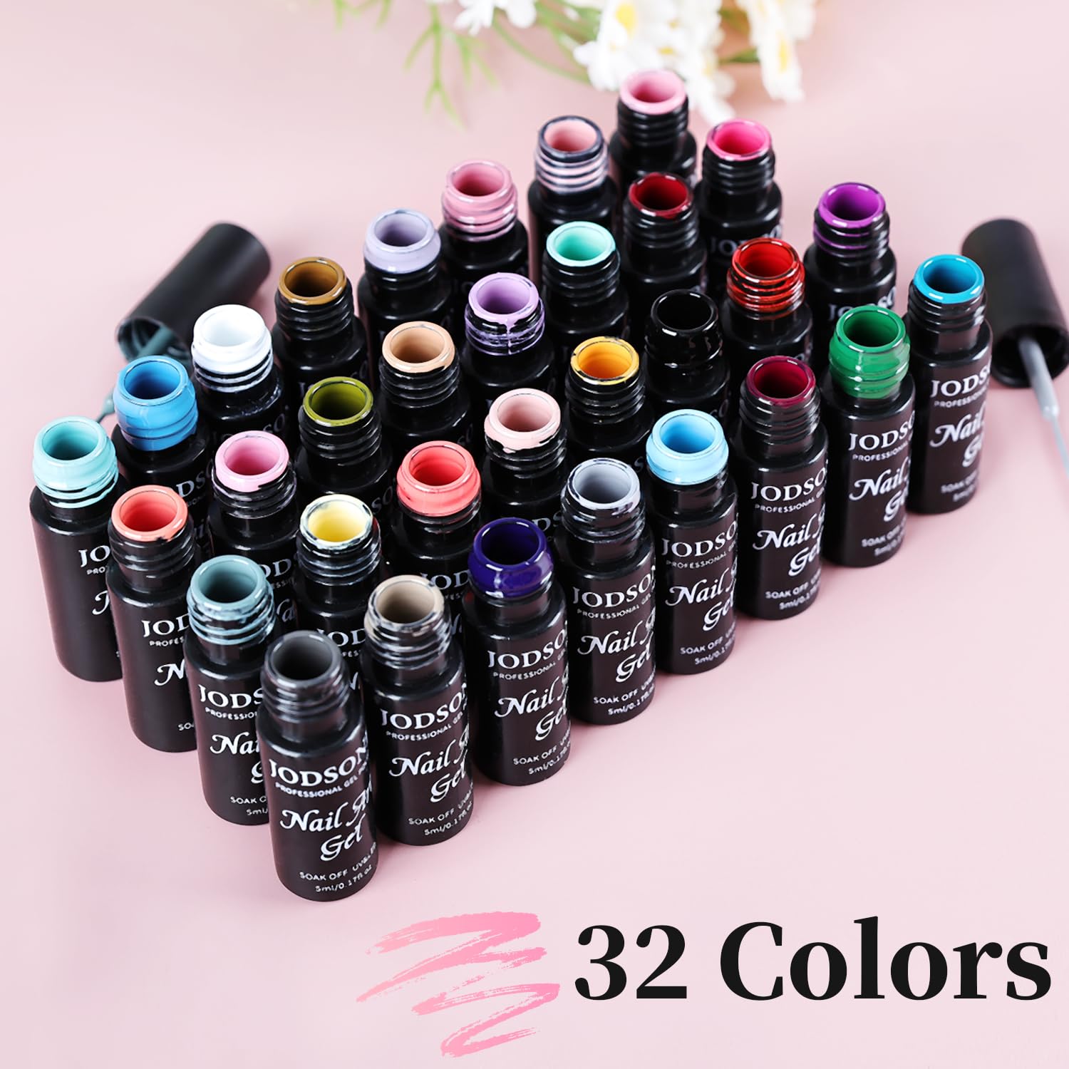 JODSONE 32-color gel pigments laid out demonstrate versatile color layering for chic nail designs.