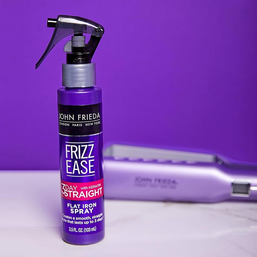 John Frieda Frizz-Ease 3 Day Straight spray applied on hair for heat protection and frizz control.