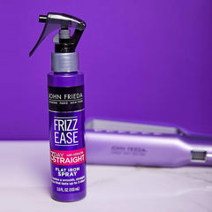 John Frieda Frizz-Ease 3 Day Straight spray applied on hair for heat protection and frizz control.