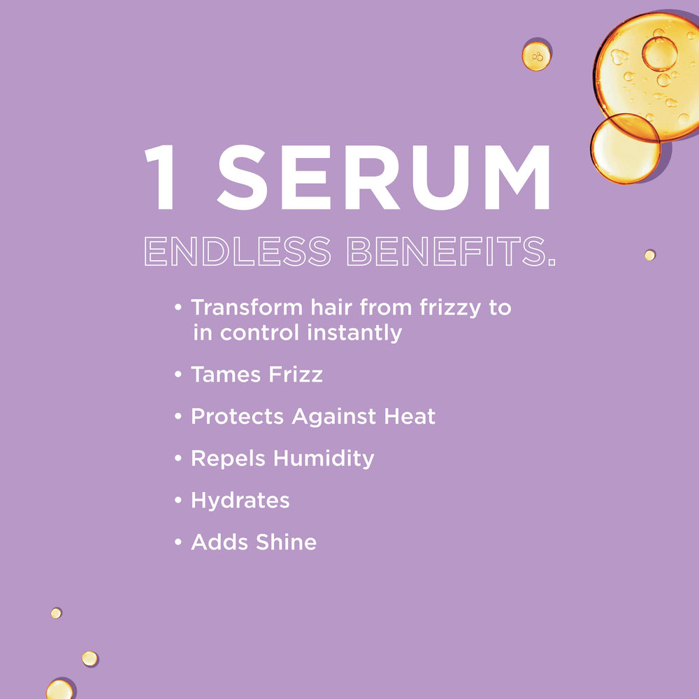 John Frieda Frizz Ease Original Hair Serum applied to hair strands for smoothing.