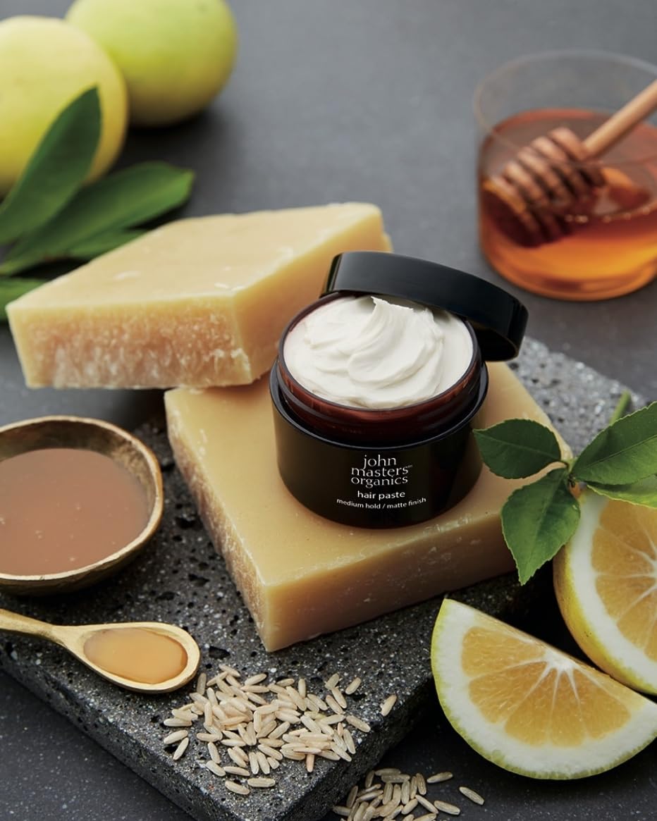 Close-up of textured hair with John Masters Organics paste for definition.