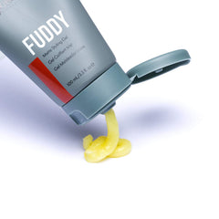 Johnny B. Fuddy gel on hand for even distribution during styling