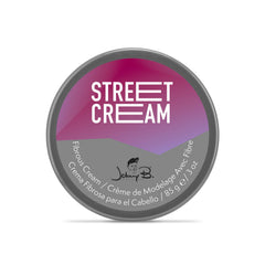 JOHNNY B. Street Cream hands applying pliable formula for added volume.
