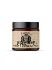 Johnny Slicks Formula 49 clay pomade bottle closeup showing firm hold and matte finish