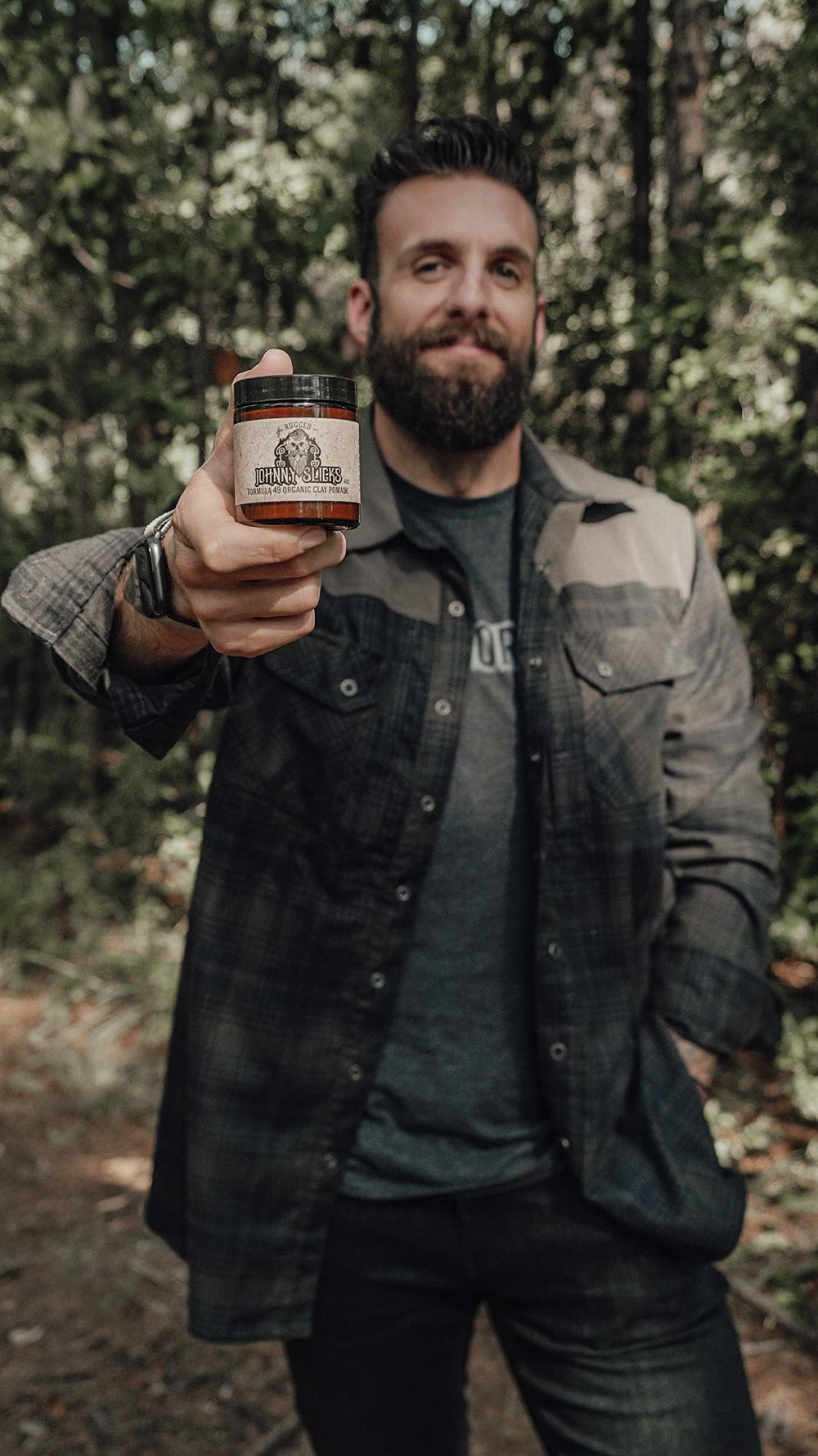Johnny Slicks Formula 49 jar in hand illustrating easy application for versatile styling