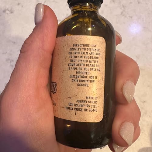 Johnny Slicks ingredients label featuring tea tree, argan, and jojoba oils