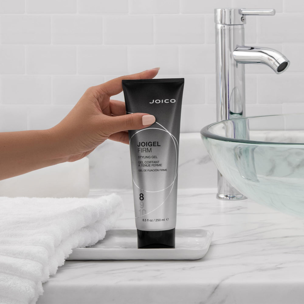 Joico JoiGel Firm bottle showing glossy shine and hydrated hair.