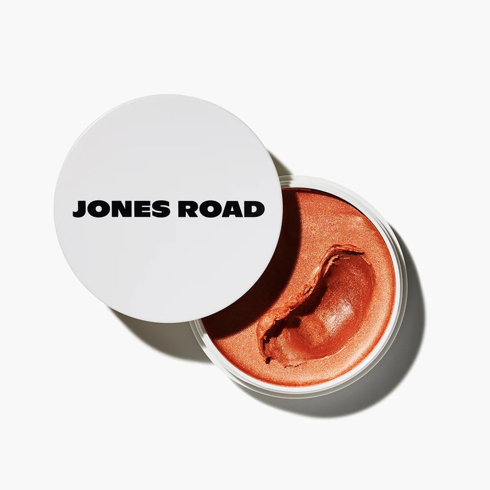 Jones Road Miracle Balm Golden Hour close-up showing warm peach tint with golden shimmer for a natural glow.