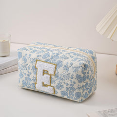 JOVAKIT alphabet makeup bag blue floral-e side shot showing spacious interior for cosmetics storage