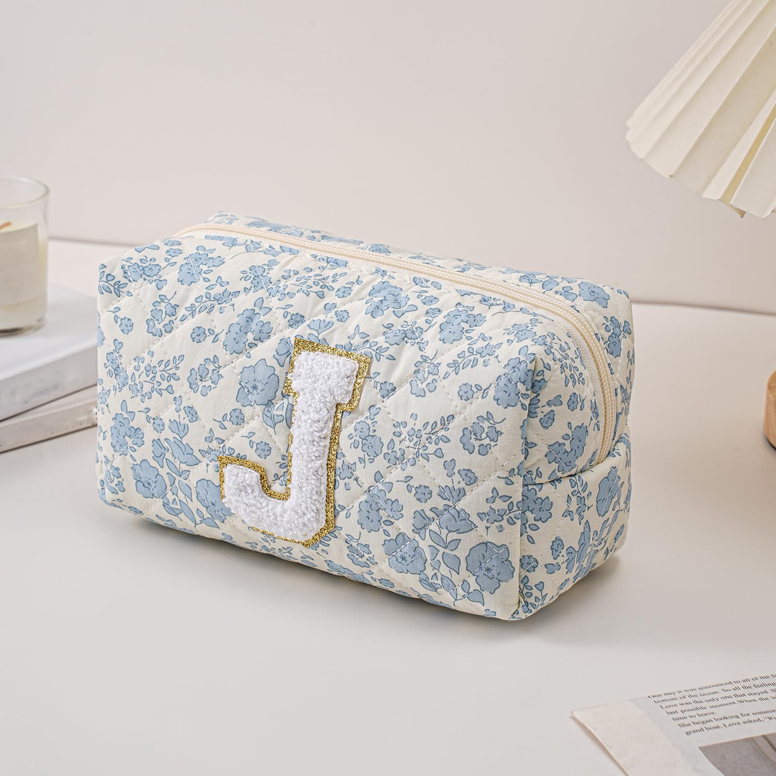 JOVAKIT Alphabet Makeup Bag blue floral open zip for easy access to cosmetics on the go.