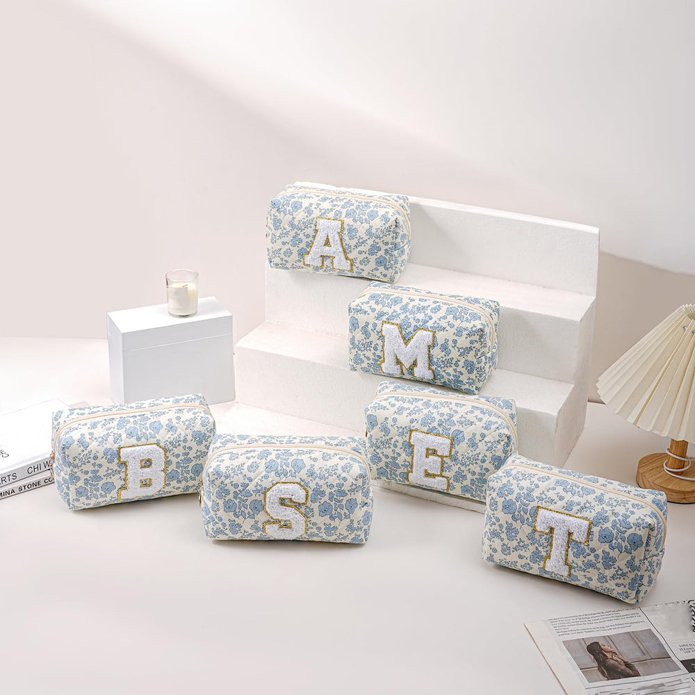 JOVAKIT blue floral bag shown open with makeup tools neatly organized.