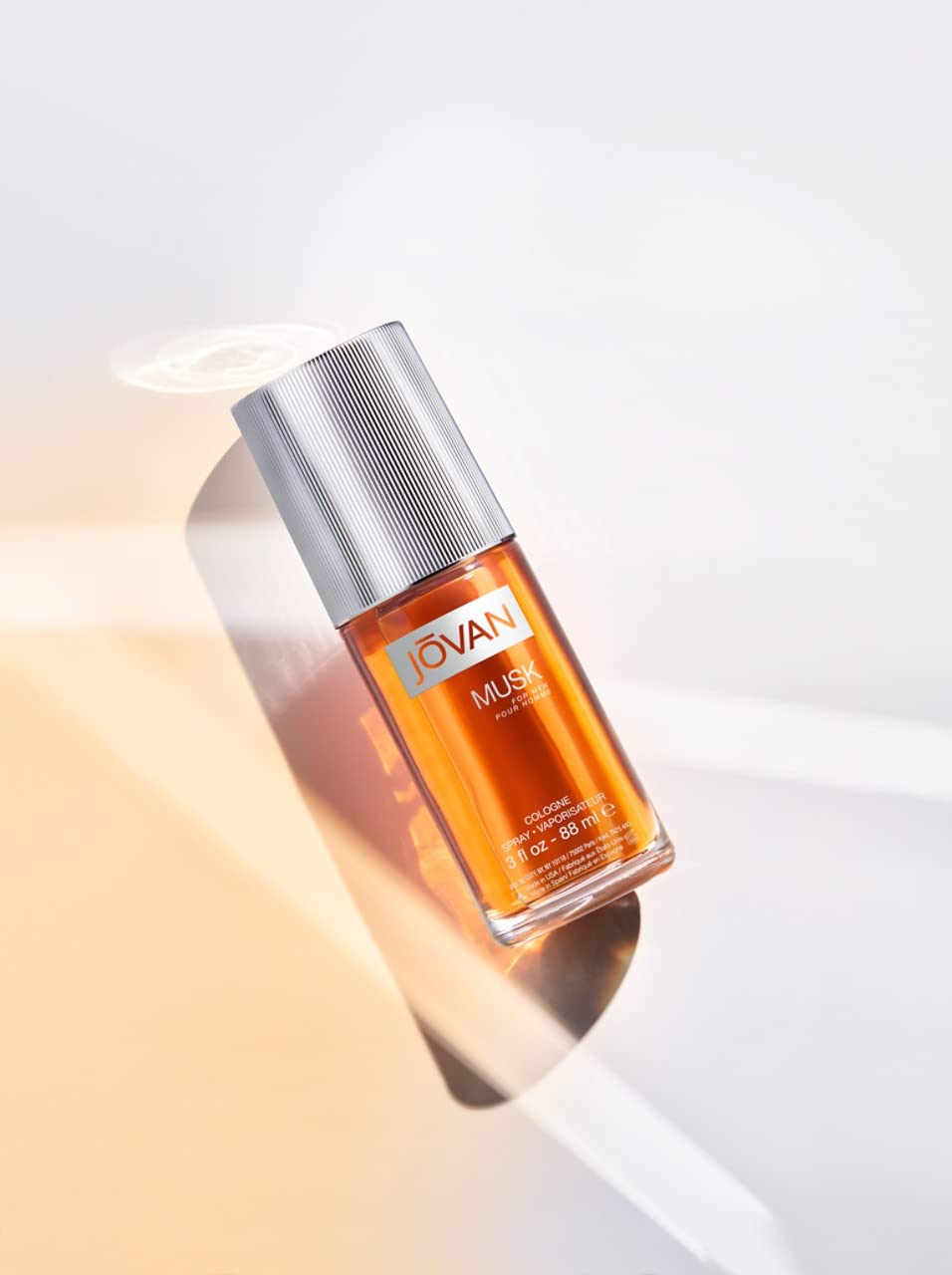 Jovan Musk for Men spray bottle releasing a smooth mist for daily wear
