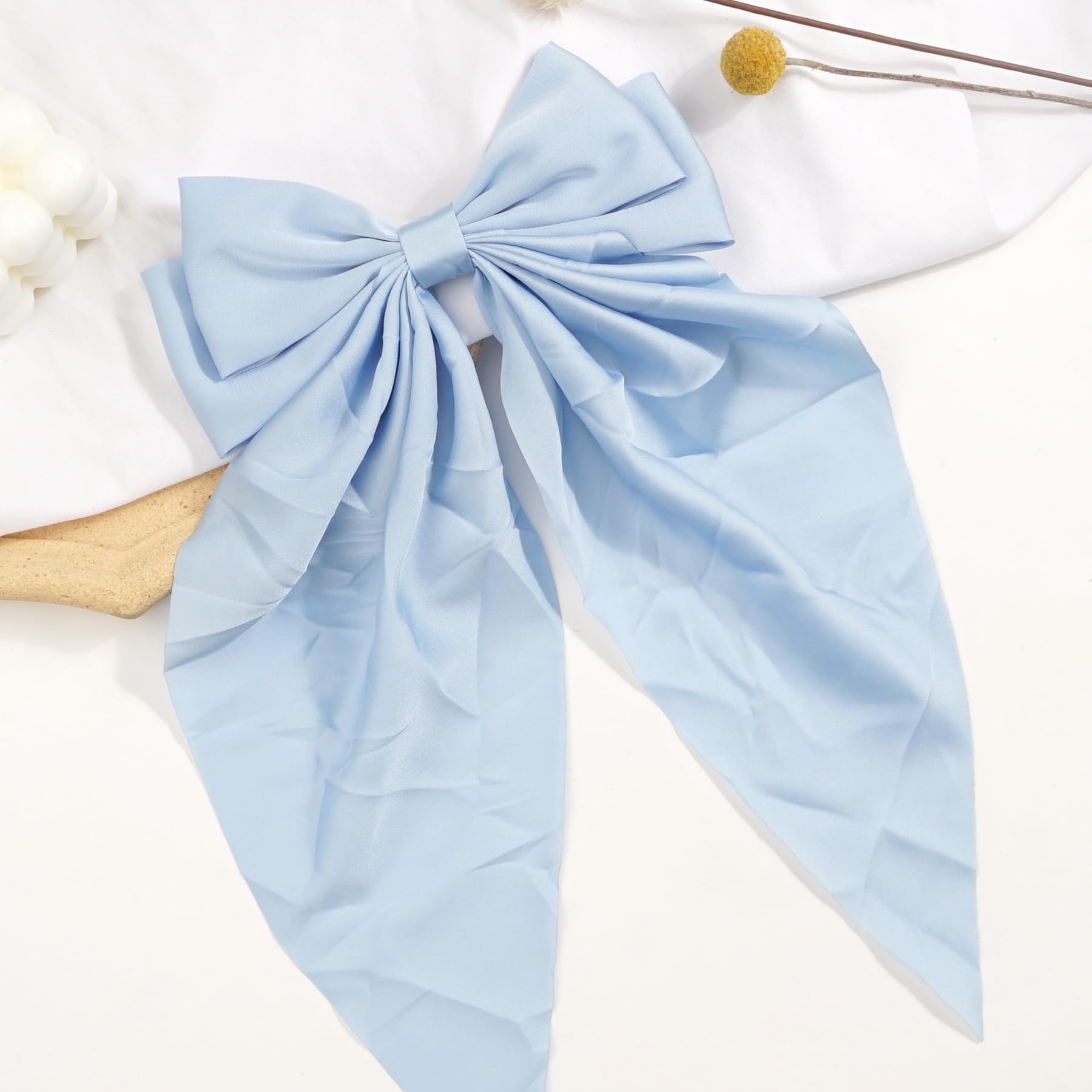 JOYOYO hair clip blue long bow in packaging signals gift-ready elegance.