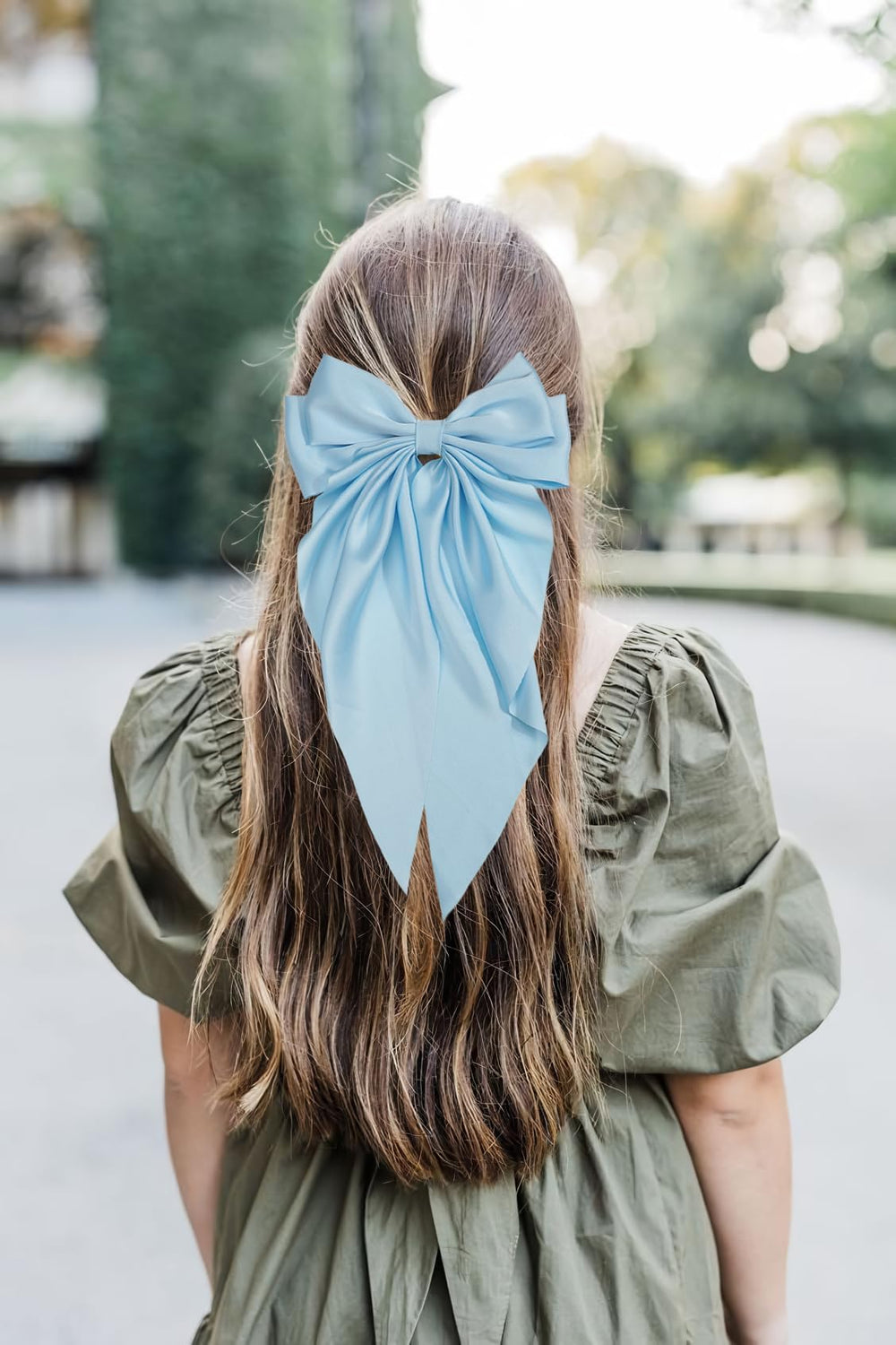 JOYOYO hair clip blue long bow on ponytail demonstrates effortless day-to-night styling.