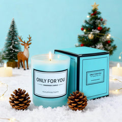 Joyvella ocean candle emits warm glow and marine-inspired scent.