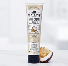 J.R. Watkins coconut hand cream on hands for softer, smoother skin.