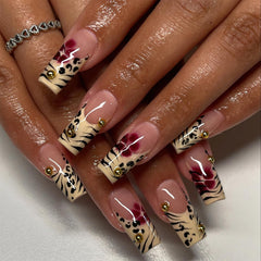 Jremg leopard print French tip nails on hand for bold autumn style.