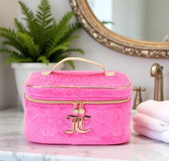 Juicy Couture makeup bag interior with pockets, keeps brushes and bottles neatly organized.