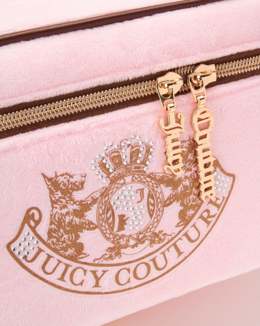 Juicy Couture pink makeup bag with durable zipper ensures secure, ready-for-travel storage.